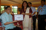 First Lady Anupama Singh felicitating former footballer Indrajit Namchum during the inaugural function of the Fine Arts exhibition at Hotel Arun Subansiri : 20/08/2010 