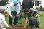 Lok Sabha Speaker Meira Kumar planting a sapling of Azalea at Raj Bhavan as Governor and Lok Sabha Secretary General T K Vishwanathan looks on: 28/04/2011