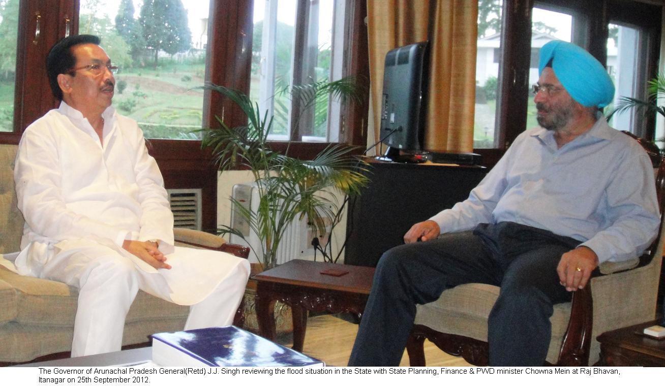 Governor General (Retd) J.J. Singh reviewing the flood situation in the State with State Planning, Finance & PWD minister Chowna Mein at Raj Bhavan, Itanagar: 25/09/2012