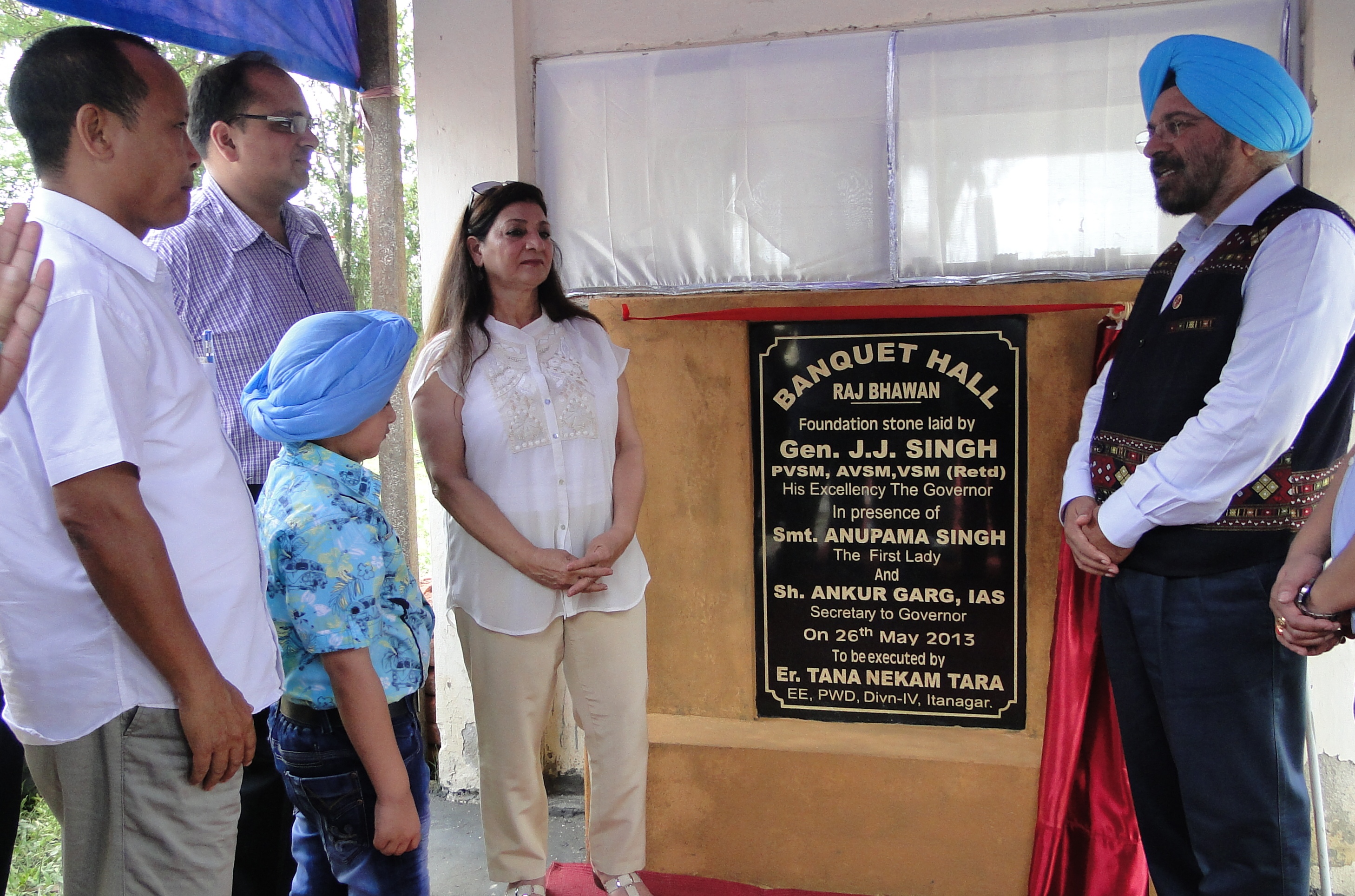 The Governor of Arunachal Pradesh Gen (Retd) J.J. Singh unfurling the foundation stone for a State-of-the art Banquet Hall at Raj Bhawan, Itanagar:26/05/2013. Also seen: First lady of the State Smti Anupama Singh and Secretary to Governor Shri Ankur Garg