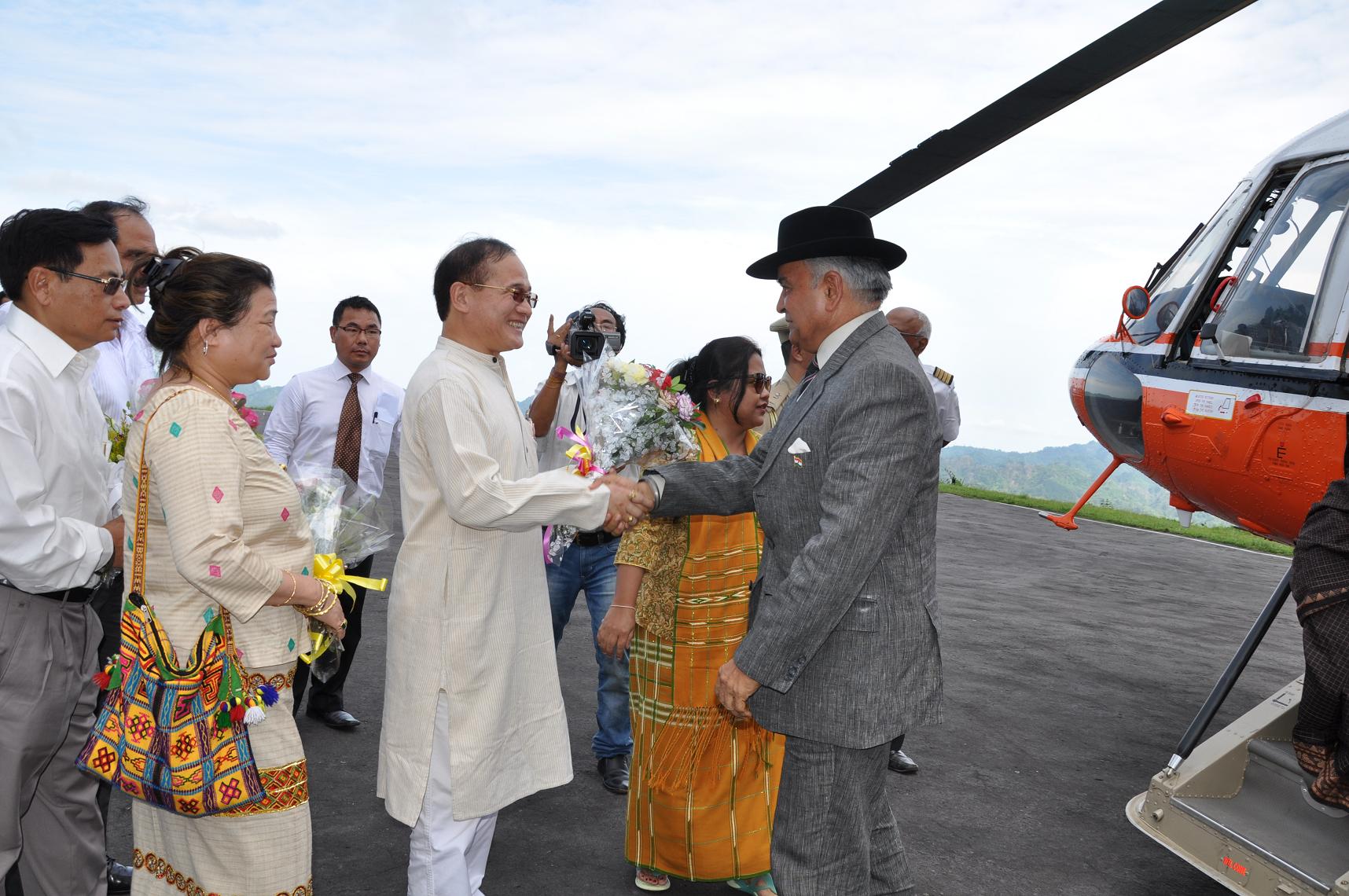 The Governor of Arunachal Pradesh designated Lt. Gen (Retd) Nirbhay Sharma received by Chief Minister Shri Nabam Tuki on his arrival at Raj Bhawan Helipad, Itanagar:28/05/2013. Also seen: Shri Wanglin Lowangdong, Speaker Arunachal Pradesh State Legislative Assembly and Smti Nabam Yani, wife of Shri Nabam Tuki