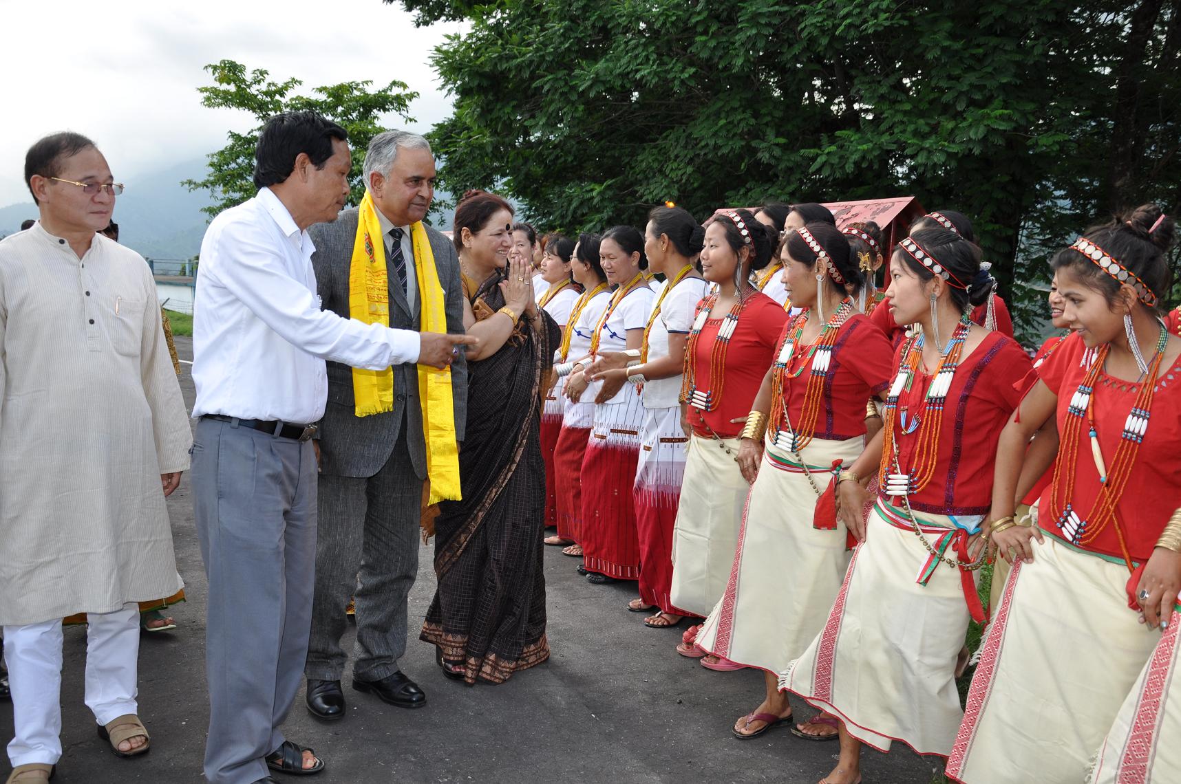 The Governor of Arunachal Pradesh designated Lt. Gen (Retd) Nirbhay Sharma and his wife Smti Jyotsna Sharma accorded traditional reception by cultural troupes of different tribes of the State at Raj Bhawan Helipad, Itanagar on his arrival:28/05/2013. Also seen Chief Minister Shri Nabam Tuki and Art and Culture Deputy Director Shri Jomnya Siram.