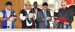 Governor of Arunachal Pradesh Lt Gen (Retd) Nirbhay Sharma administrating the oath of office and secrecy to newly inducted ministers (L to R) Shri Kumar Waii, Shri Gojen Gadi and Shri Kalikho Pul at Darbar Hall, Raj Bhawan, Itanagar on 28th February 2014