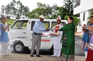 The First Lady of the State Smt. Jyostna Sharma handing over the keys of a five-seated Omni Van to Shri. H.Sharma, Principal of Donyi Polo Mission School for Hearing & Visually Impaired, Chimpu on 20th June 2014