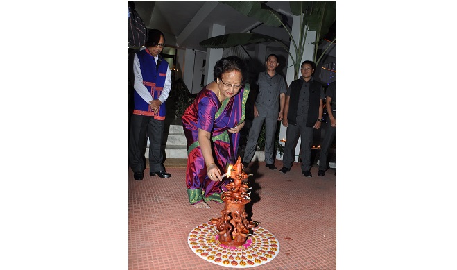 The First Lady of the State Smt Rita Rajkhowa lighting the ceremonial diya during the Deepawali celebration at Raj Bhavan, Itanagar on 11th November 2015