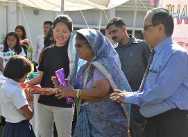 The First Lady of the State Smt Rita Rajkhwa distributing the prizes to the winners of games and sports competitions during the Childrens Day celebration at Raj Bhavan, Itanagar on 14th November 2015. Also seen: The Governor of Arunachal Pradesh Shri JP Rajkhowa.