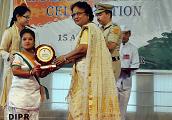 Team leader of cultural team from Oju Welfare Mission School, Naharlagun being felicitated by First Lady of the State Smt Rita Rajkhowa : 15/08/2015