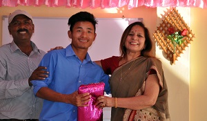 TThe First Lady of the State Smt Neelam Mishra giving prize to the best student of Donyi Polo Mission School for the Hearing and Visually Impaired during the World Day for the Disabled celebration, Chimpu, Itanagar on 3rd December 2017.