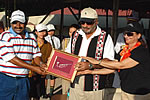 Governor and First lady presenting a Memento to Golf coach Shri Ali Sher